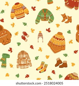 Warm knitted clothes and autumn leaves seamless pattern. Sweater and hat, socks and gloves.Vector stock illustration.
