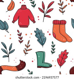 Warm knitted clothes and shoes seamless autumn pattern. Background with sweater, scarf, socks and boots. Fall print with foliage and wardrobe items for packaging, paper and design vector illustration