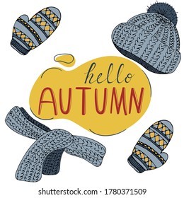 warm knitted cozy things, clothes and the inscription hello autumn in an abstract spot on a white background in doodle style, vector illustration for a postcard