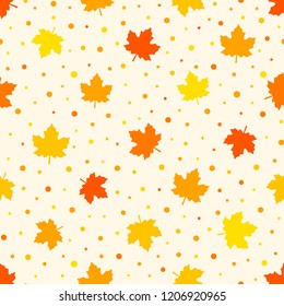 Warm seamless autumn pattern. Orange, red and yellow maple leaves and dots on a beige background. Endless vector texture for your design