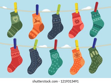 warm socks hanging on the rope outdoor. Winter vector illustration.