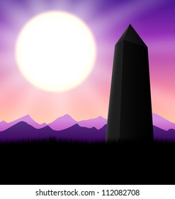 Warm sunset with obelisk silhouette