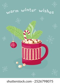 Warm winter wishes. Greeting card with image of cocoa with marshmallows, hot chocolate with marshmallows, caramel in red cup on a background of fir branches with a New Year's ball. Cozy winter drink.