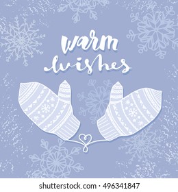 Warm wishes.Greeting quote about winter holiday season. Modern calligraphy phrase with hand drawn snowflakes and mittens. Lettering for christmas greeting cards and posters