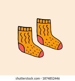 Calurosos calcetines de punto amarillos. Ilustración del doodle dibujado a mano por el vector