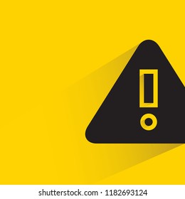 warning sign with drop shadow in yellow background