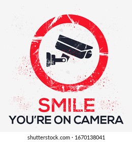  Warning sign (Smile you’re on camera), vector illustration.