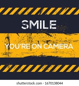  Warning sign (Smile you’re on camera), vector illustration.