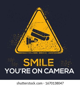  Warning sign (Smile you’re on camera), vector illustration.