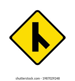 Warning of skewed side road junction on right traffic sign. Yellow background.