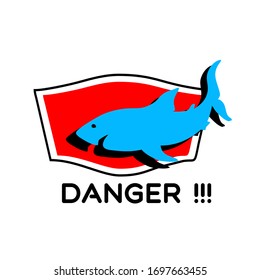 a warning to tourists on the beach about the dangers of sharks
