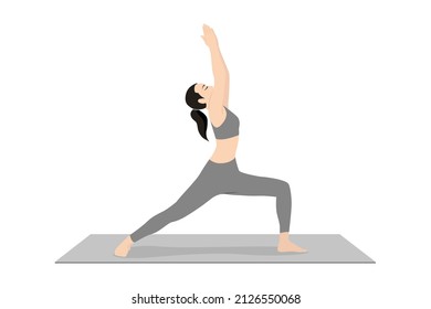 Warrior Pose I. Beautiful girl practice Virabhadrasana I. Young attractive woman practicing yoga exercise. working out, black wearing sportswear, grey pants and top, indoor full length, calmness relax