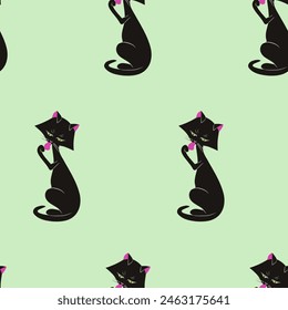 Washing black cat.Simple seamless pattern on green background. For wallpaper, fabric, wrapping paper, background.
