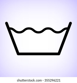 washing by machine or hands  - black vector icon