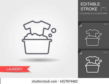 Washing clothes. Outline icon with editable stroke. Linear symbol of the cleaning and housework with shadow