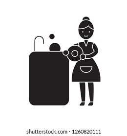 Washing dishes black vector concept icon. Washing dishes flat illustration, sign