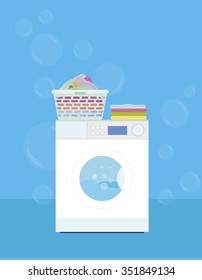 Washing machine with a basket of laundry on a blue background - vector illustration