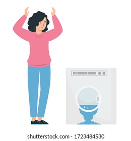 La lavadora se ha roto y ha fluido. Una mujer está parada con los brazos levantados junto a los electrodomésticos. 