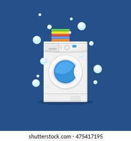 Washing machine and towels linen isolated on blue background. Equipment housework laundry wash clothes. Washer and flying bubbles in flat style.