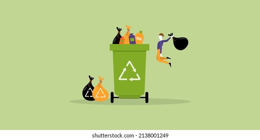 Waste management concept. A man holding a black bag and garbage is jumping to throw it in a green recycling bin. Reduce environmental pollution, be eco-friendly, save climate and nature.