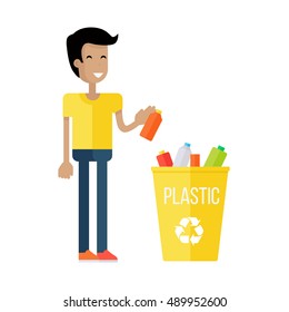 Waste recycling concept. Boy in yellow t-shirt and blue pants taking out the trash in yellow recycle garbage bin with plastic. Sorting process different types of waste. Environment protection.