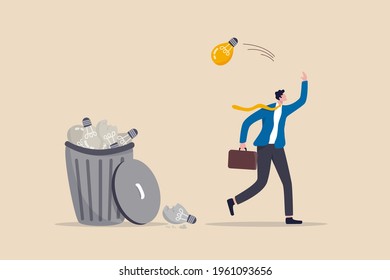 Wasted unworkable ideas, business failure or too many abandoned projects concept, frustrated businessman throw away lightbulb idea into full of junk idea in basket bin.