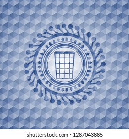 wastepaper basket icon inside blue emblem with geometric background.
