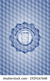 wastepaper basket icon inside blue badge with geometric pattern. 