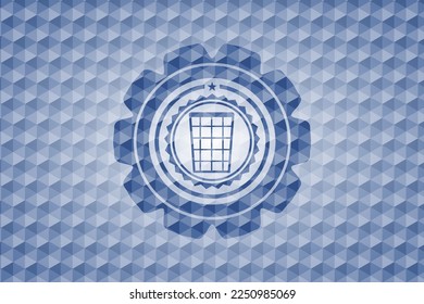 wastepaper basket icon inside blue badge with geometric background. 