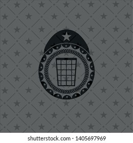 wastepaper basket icon inside dark badge or emblem