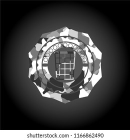 wastepaper basket icon inside grey camouflage emblem