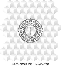 wastepaper basket icon inside grey badge with geometric cube white background
