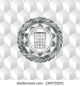 wastepaper basket icon inside grey emblem with geometric cube white background