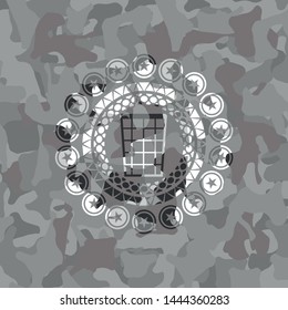wastepaper basket icon inside grey camouflaged emblem