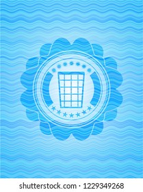 wastepaper basket icon inside light blue water wave emblem.