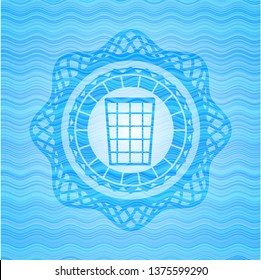 wastepaper basket icon inside light blue water wave style badge.