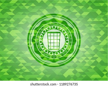 wastepaper basket icon inside realistic green emblem. Mosaic background