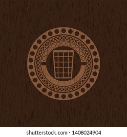 wastepaper basket icon inside realistic wood emblem