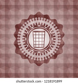 wastepaper basket icon inside red geometric badge.