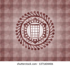 wastepaper basket icon inside red seamless geometric badge.