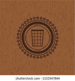 wastepaper basket icon inside retro style wood emblem