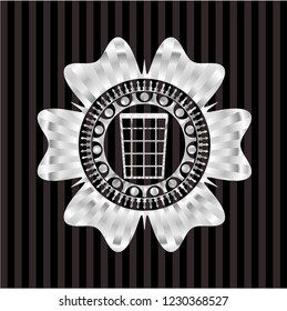 wastepaper basket icon inside silvery badge or emblem