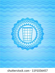 wastepaper basket icon inside water concept style badge.