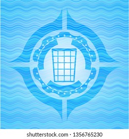 wastepaper basket icon inside water representation emblem.