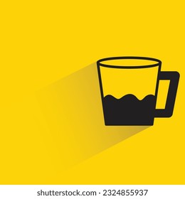 water cup with shadow on yellow background