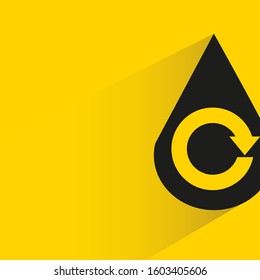 water drop and reuse symbol with drop shadow on yellow background