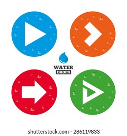 Water drops on button. Arrow icons. Next navigation arrowhead signs. Direction symbols. Realistic pure raindrops on circles. Vector