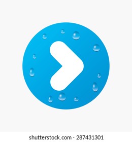 Water drops on button. Arrow sign icon. Next button. Navigation symbol. Realistic pure raindrops. Blue circle. Vector