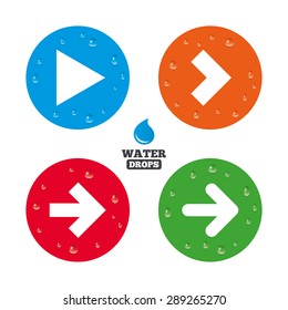 Water drops on button. Arrow icons. Next navigation arrowhead signs. Direction symbols. Realistic pure raindrops on circles. Vector