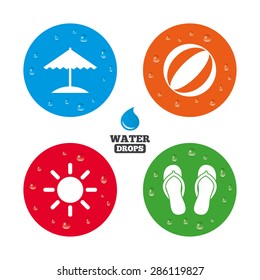 Water drops on button. Beach holidays icons. Ball, umbrella and flip-flops sandals signs. Summer sun symbol. Realistic pure raindrops on circles. Vector